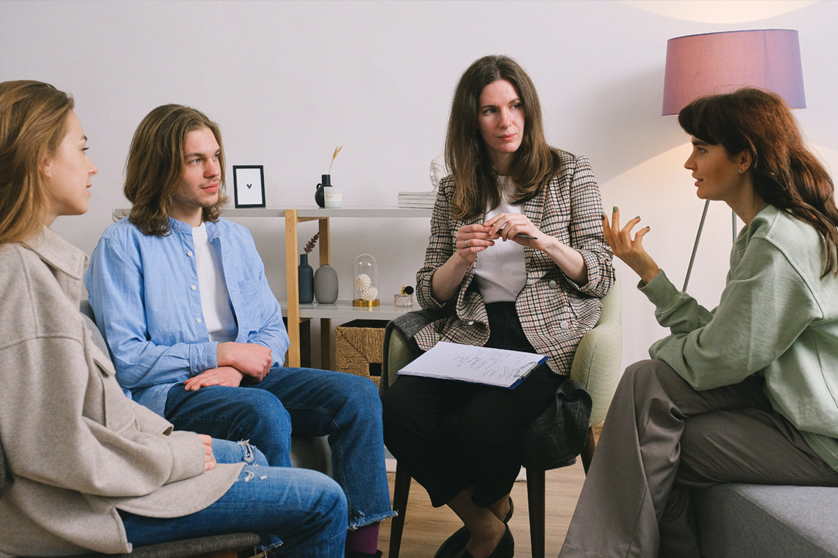 Four people in a support group setting